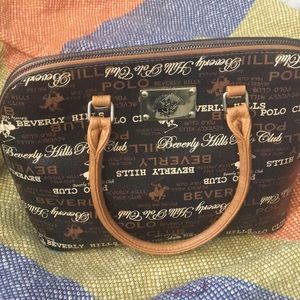 Im selling this polo club beverly hills purse; color brown, black, light brown